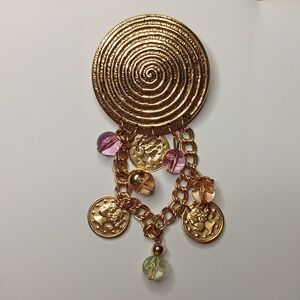 Vintage gold tone statement brooch with faux tin coins and beads on a chain